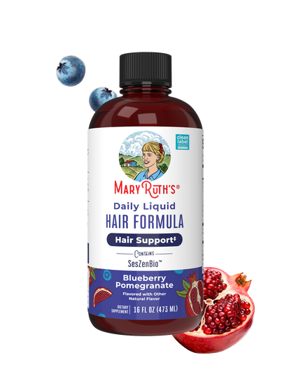 Mary Ruth's Daily Liquid Hair Formula bottle with blueberries and pomegranate on a white background