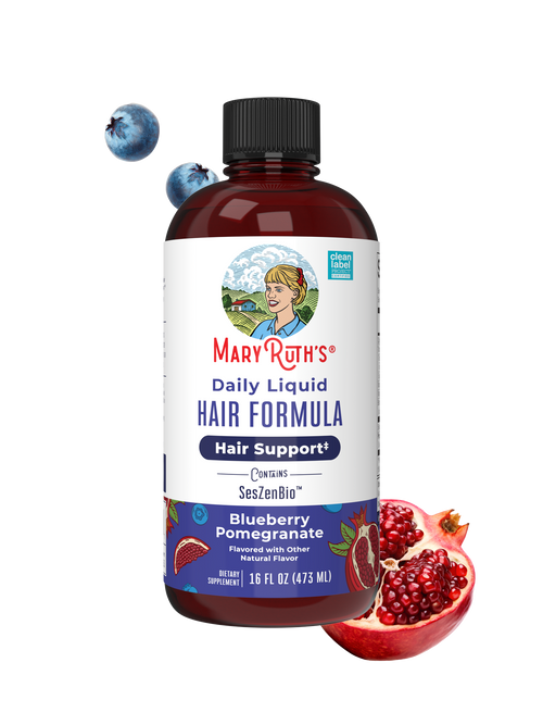 Mary Ruth's Daily Liquid Hair Formula bottle with blueberries and pomegranate on a white background